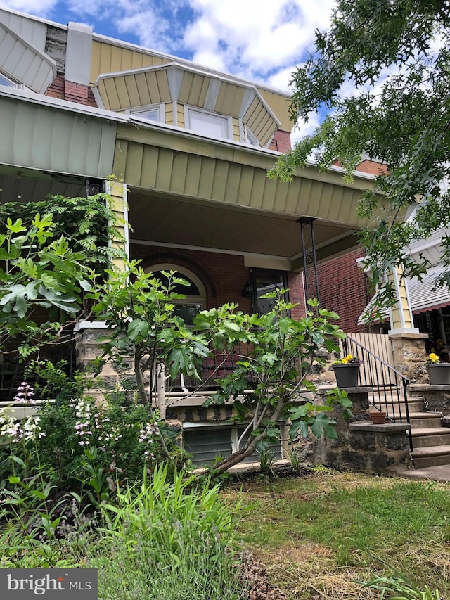5015 Osage Ave, Philadelphia, PA 19143 - view of side of property with board and batten siding and brick siding