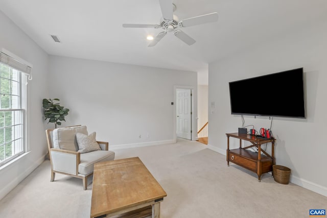 2402 Pendower Ln, Keswick, VA 22947 - sitting room with light colored carpet, baseboards, ceiling fan, and an upstairs landing