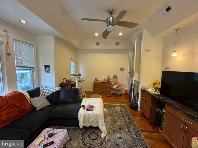4635 Sansom St, Philadelphia, PA 19139 - living area featuring dark wood-type flooring, a ceiling fan, a raised ceiling, and recessed lighting