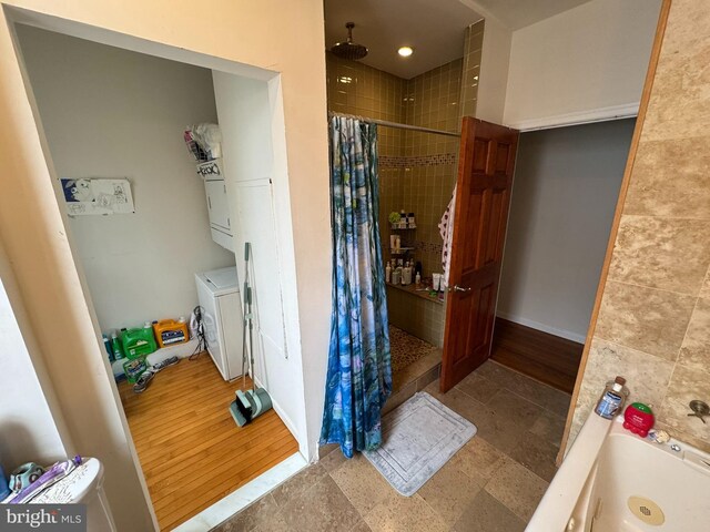 4635 Sansom St, Philadelphia, PA 19139 - full bathroom featuring tiled shower, separate washer and dryer, and a tub