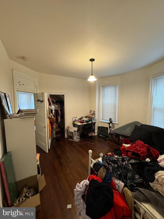 4635 Sansom St, Philadelphia, PA 19139 - bedroom with dark wood-style floors and a walk in closet