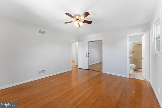 4503 Poppe Pl, Temple Hills, MD 20748 - unfurnished bedroom featuring baseboards, light wood-type flooring, and ensuite bathroom