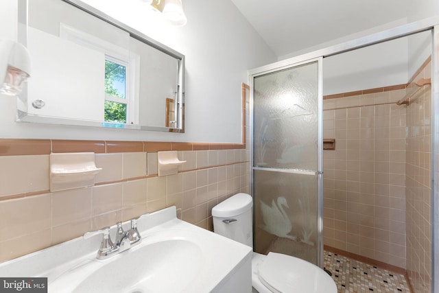 4503 Poppe Pl, Temple Hills, MD 20748 - bathroom featuring a stall shower, tile walls, toilet, and vanity
