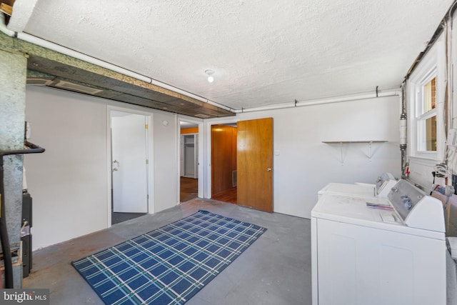 4503 Poppe Pl, Temple Hills, MD 20748 - laundry room with washing machine and dryer and a textured ceiling
