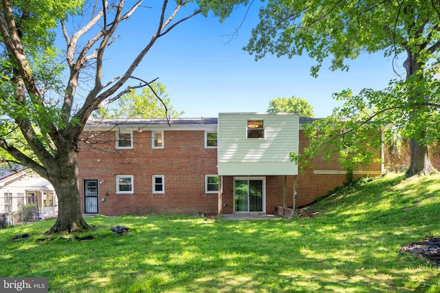 4503 Poppe Pl, Temple Hills, MD 20748 - rear view of house with brick siding and a lawn