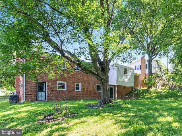 4503 Poppe Pl, Temple Hills, MD 20748 - back of property with a lawn, central AC unit, and brick siding