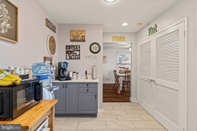 1019 Harbour, Palmyra, NJ 08065 - bar with black microwave, a ceiling fan, light tile patterned flooring, recessed lighting, and baseboards