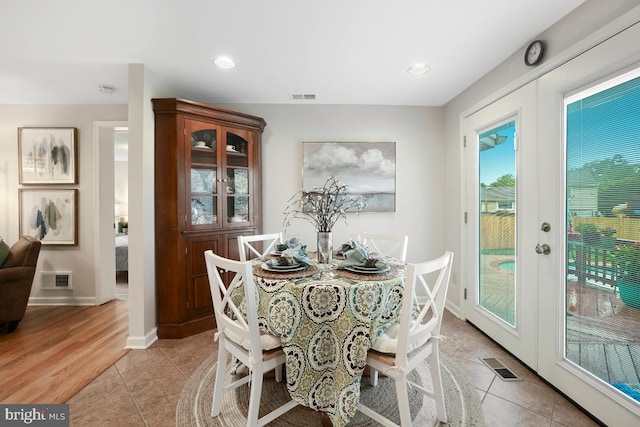 8588 King Carter St, Manassas, VA 20110 - dining space featuring light tile patterned floors, recessed lighting, baseboards, and french doors