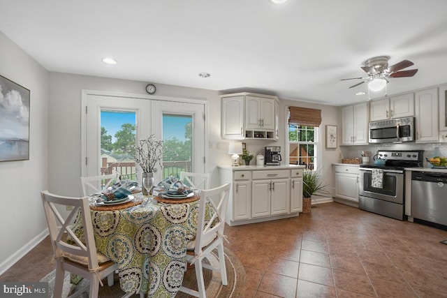 8588 King Carter St, Manassas, VA 20110 - kitchen featuring appliances with stainless steel finishes, baseboards, recessed lighting, ceiling fan, and light countertops