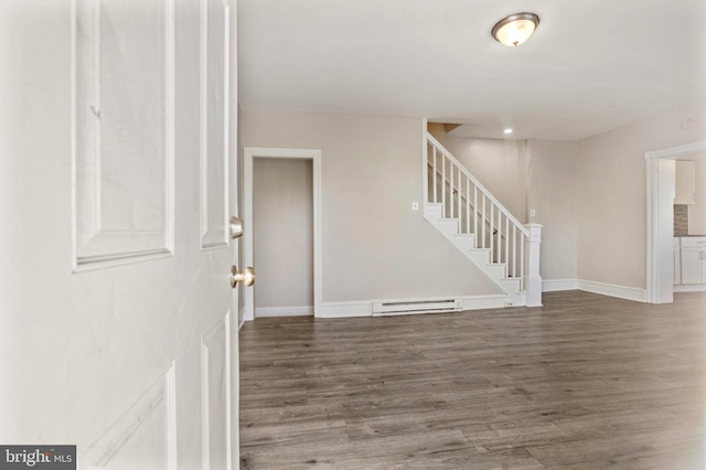100 Chester Pike, Darby, PA 19023 - entrance foyer featuring baseboard heating, stairway, wood finished floors, and baseboards