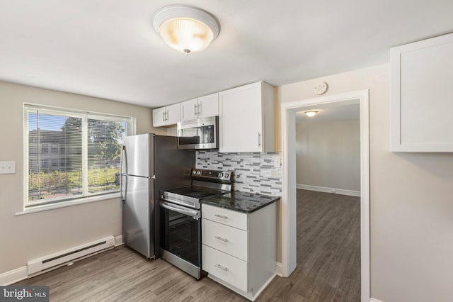 100 Chester Pike, Darby, PA 19023 - kitchen with stainless steel appliances, a baseboard radiator, baseboards, and light wood finished floors