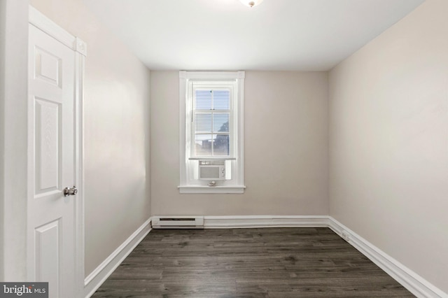 100 Chester Pike, Darby, PA 19023 - unfurnished room featuring a baseboard radiator, dark wood-type flooring, and baseboards