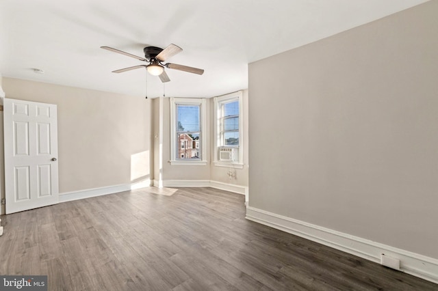 100 Chester Pike, Darby, PA 19023 - spare room featuring a ceiling fan, dark wood finished floors, and baseboards