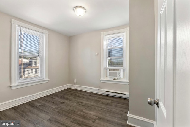 100 Chester Pike, Darby, PA 19023 - empty room with a baseboard radiator, dark wood-type flooring, and baseboards