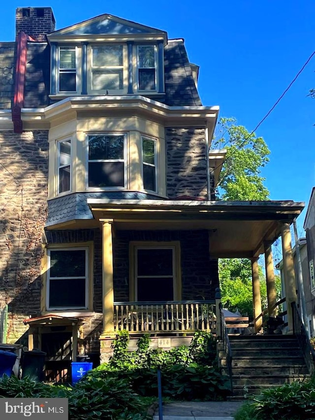414 E Church Ln, Philadelphia, PA 19144 - view of front of house with a porch, mansard roof, and a high end roof