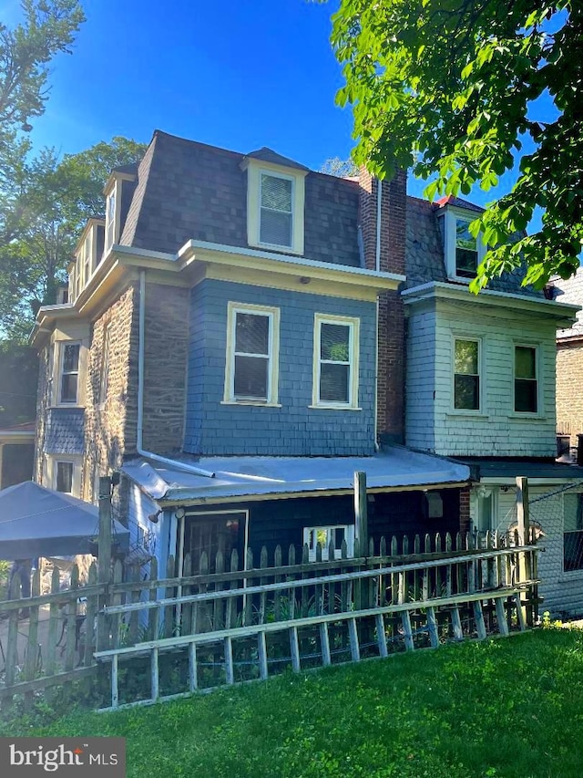 414 E Church Ln, Philadelphia, PA 19144 - rear view of property featuring mansard roof and a shingled roof
