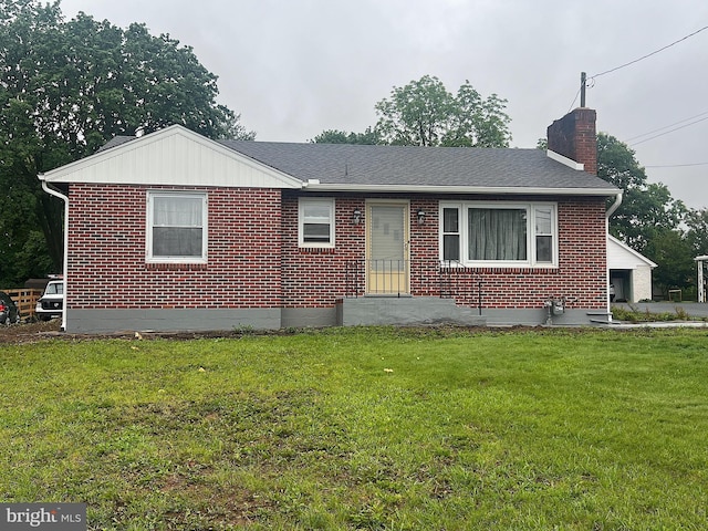 622 S Allison St, Greencastle, PA 17225 - view of front facade with a chimney, brick siding, and a front yard