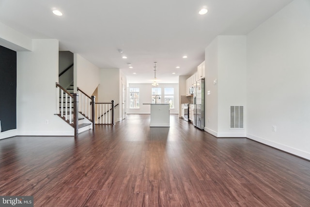 5163 Ridgeview Retreat Dr, Chantilly, VA 20151 - unfurnished living room featuring dark wood-style flooring, baseboards, stairs, and recessed lighting