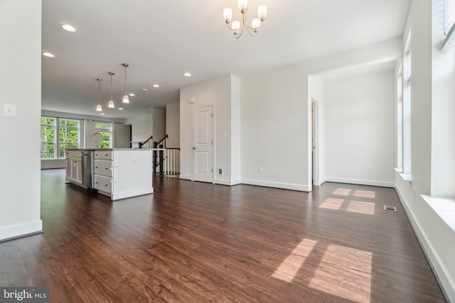 5163 Ridgeview Retreat Dr, Chantilly, VA 20151 - unfurnished living room with dark wood-type flooring, a chandelier, baseboards, recessed lighting, and stairs