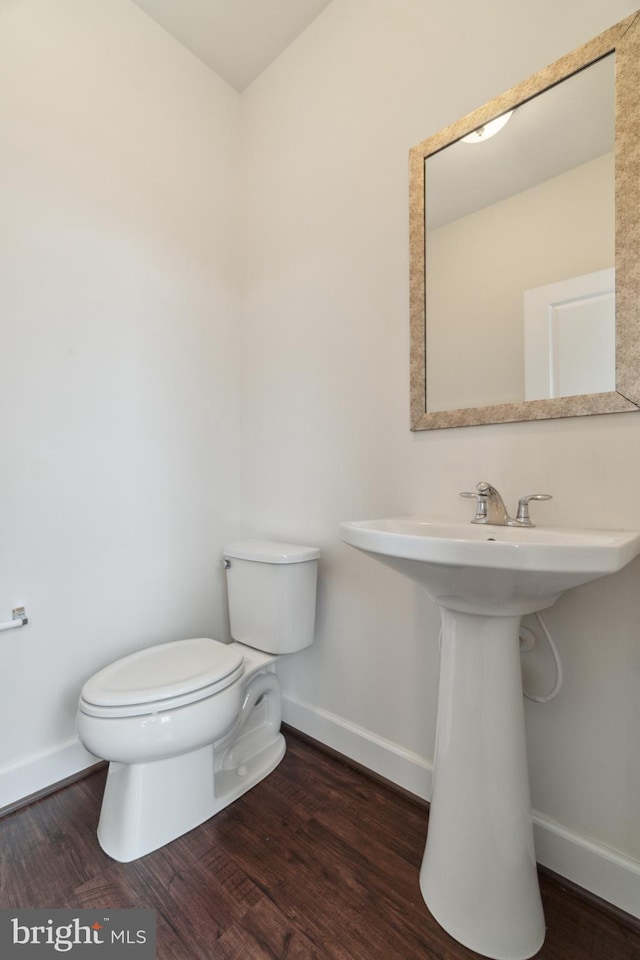 5163 Ridgeview Retreat Dr, Chantilly, VA 20151 - half bath with toilet, baseboards, wood finished floors, and a sink