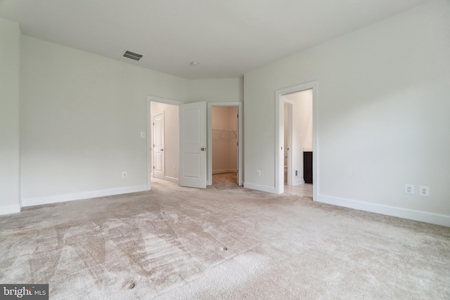 5163 Ridgeview Retreat Dr, Chantilly, VA 20151 - unfurnished bedroom featuring a spacious closet, light colored carpet, and baseboards