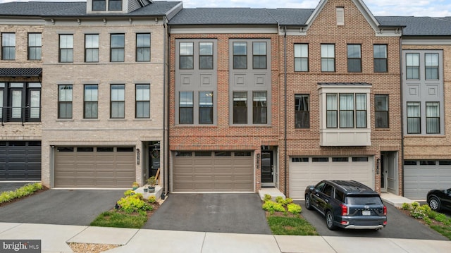 5163 Ridgeview Retreat Dr, Chantilly, VA 20151 - townhome / multi-family property featuring a garage, brick siding, and driveway