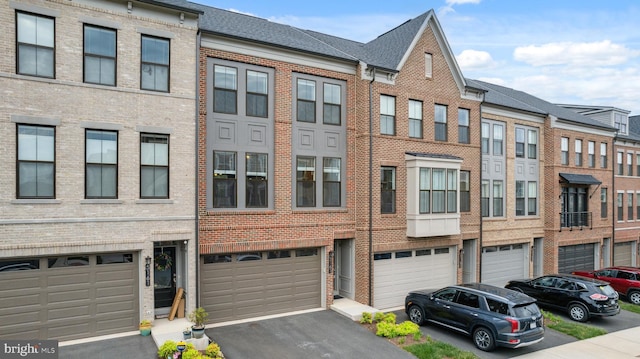 5163 Ridgeview Retreat Dr, Chantilly, VA 20151 - view of front of home with brick siding, a garage, and driveway