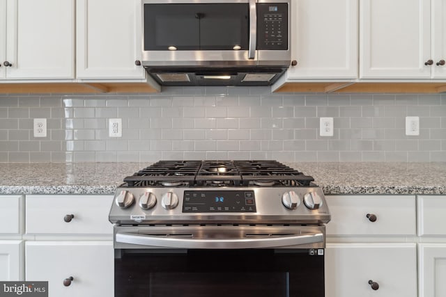 5163 Ridgeview Retreat Dr, Chantilly, VA 20151 - kitchen with appliances with stainless steel finishes, white cabinets, and decorative backsplash