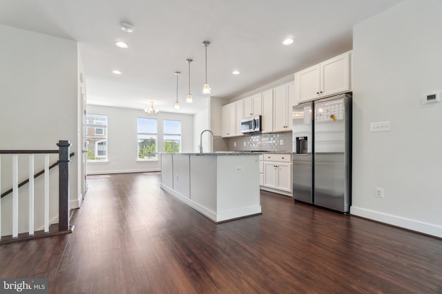 5163 Ridgeview Retreat Dr, Chantilly, VA 20151 - kitchen with appliances with stainless steel finishes, white cabinetry, dark wood-style flooring, decorative backsplash, and stone countertops