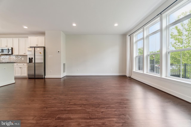 5163 Ridgeview Retreat Dr, Chantilly, VA 20151 - unfurnished living room featuring healthy amount of natural light, dark wood finished floors, baseboards, and recessed lighting