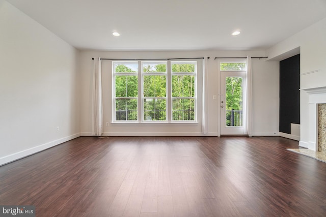 5163 Ridgeview Retreat Dr, Chantilly, VA 20151 - unfurnished living room with a high end fireplace, dark wood-style flooring, baseboards, and recessed lighting
