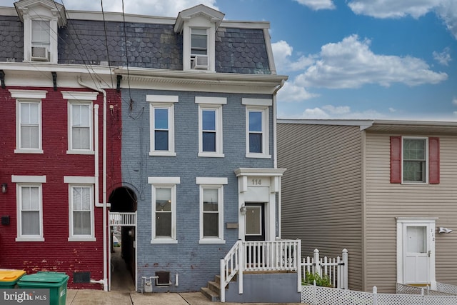 114 Walnut St, Columbia, PA 17512 - view of front of home with mansard roof, brick siding, and cooling unit