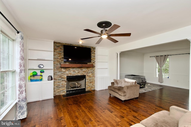 8919 Kiger St, Lorton, VA 22079 - living area featuring built in features, hardwood / wood-style flooring, a ceiling fan, and a fireplace
