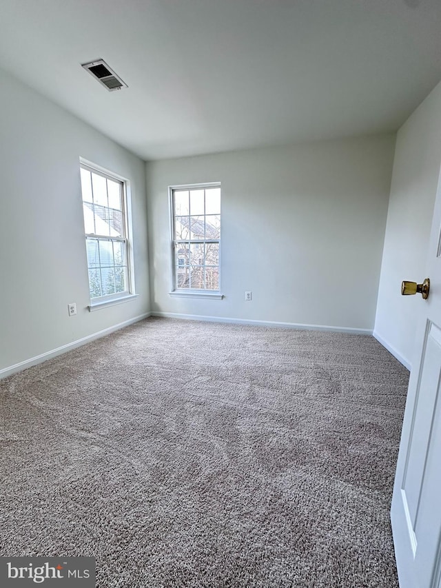 3313 Cornwell Dr SE, Washington, DC 20032 - carpeted empty room featuring baseboards