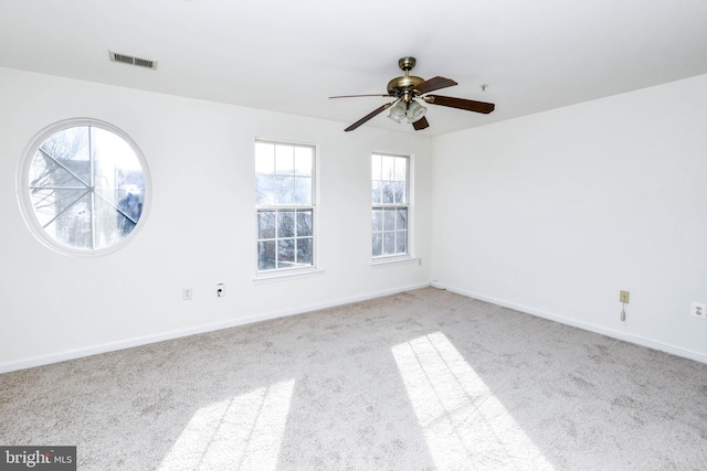 3313 Cornwell Dr SE, Washington, DC 20032 - carpeted spare room featuring plenty of natural light, ceiling fan, and baseboards