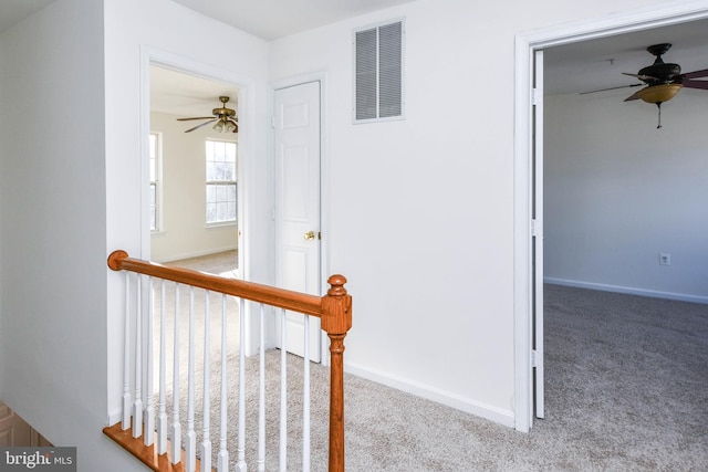 3313 Cornwell Dr SE, Washington, DC 20032 - hall with carpet floors, baseboards, and an upstairs landing