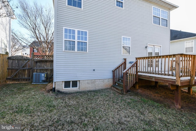 3313 Cornwell Dr SE, Washington, DC 20032 - rear view of house with central AC unit, a wooden deck, and a gate