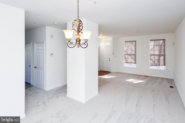 3313 Cornwell Dr SE, Washington, DC 20032 - unfurnished dining area with carpet floors, a chandelier, and baseboards