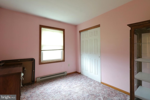 503 N Rachels Way, Aaronsburg, PA 16820 - unfurnished bedroom featuring a baseboard heating unit, carpet floors, baseboards, and a closet