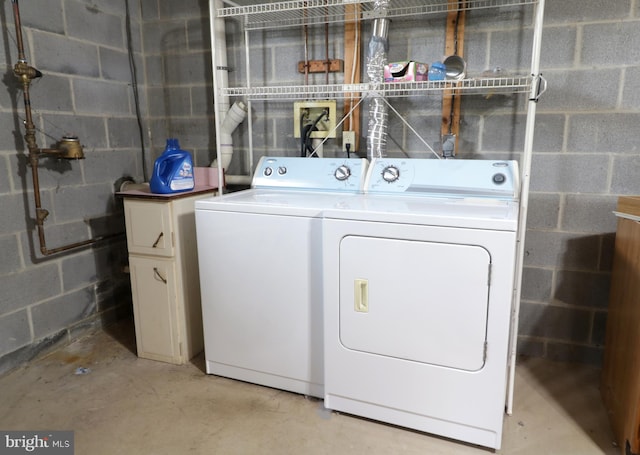 503 N Rachels Way, Aaronsburg, PA 16820 - laundry area featuring washing machine and dryer, concrete block wall, and cabinet space