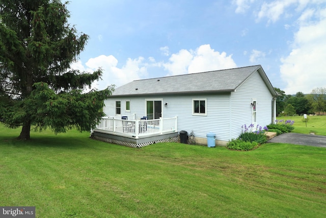 503 N Rachels Way, Aaronsburg, PA 16820 - back of property featuring a deck, a lawn, and a shingled roof