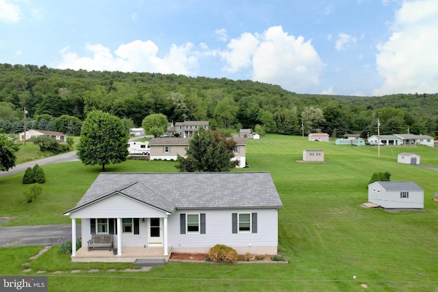 503 N Rachels Way, Aaronsburg, PA 16820 - view of front of house with a porch, a wooded view, and a front yard