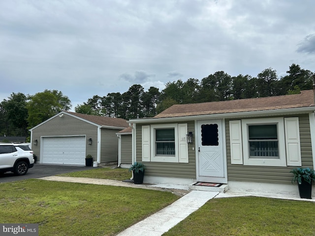 117 W Waverly St S, Browns Mills, NJ 8015 - bungalow with a garage, an outbuilding, and a front yard