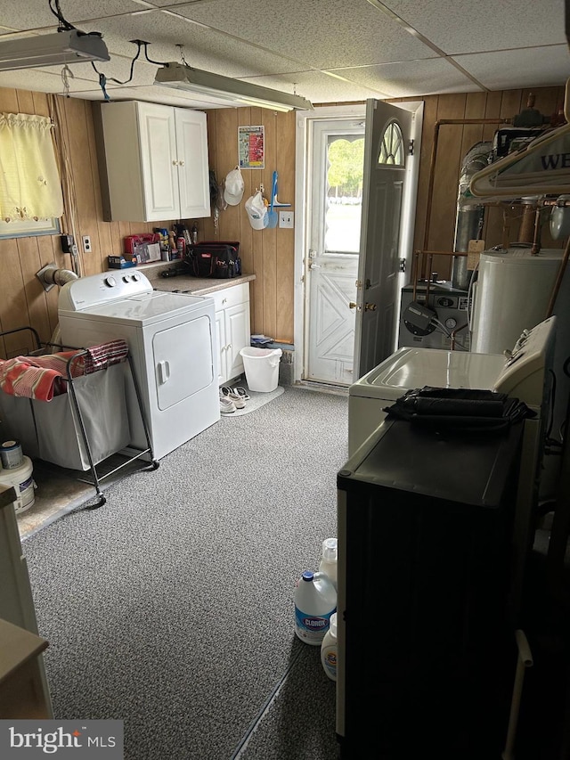 117 W Waverly St S, Browns Mills, NJ 8015 - laundry room with washer / dryer, wooden walls, water heater, carpet flooring, and cabinet space