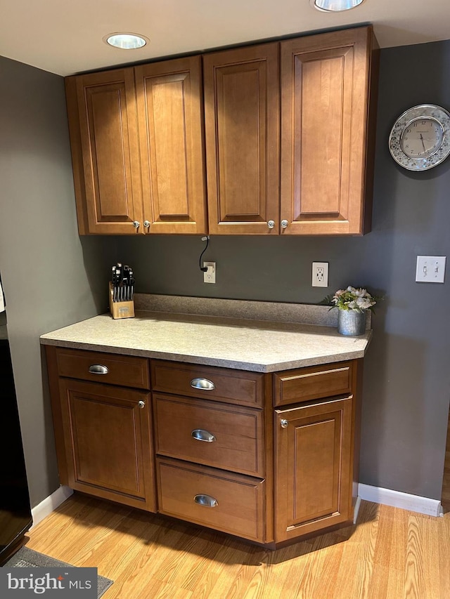 117 W Waverly St S, Browns Mills, NJ 8015 - kitchen with light wood-type flooring, baseboards, and light countertops
