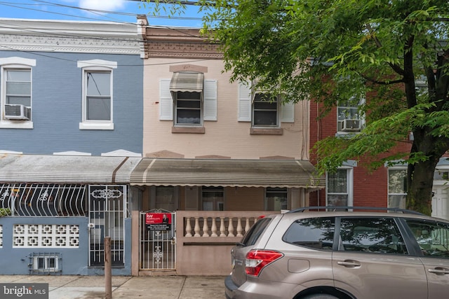 2531 N Lawrence St, Philadelphia, PA 19133 - multi unit property with brick siding, a fenced front yard, cooling unit, and a gate