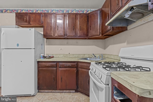2531 N Lawrence St, Philadelphia, PA 19133 - kitchen with white appliances, a sink, ventilation hood, and light countertops