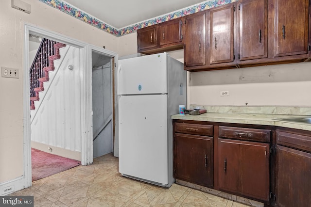 2531 N Lawrence St, Philadelphia, PA 19133 - kitchen featuring freestanding refrigerator, light countertops, light floors, and dark brown cabinetry