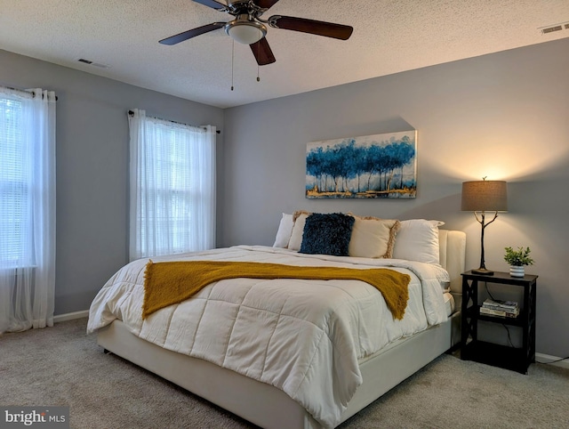407 Talon Ct, Lawrence, NJ 08648 - bedroom featuring carpet floors, a textured ceiling, a ceiling fan, and baseboards