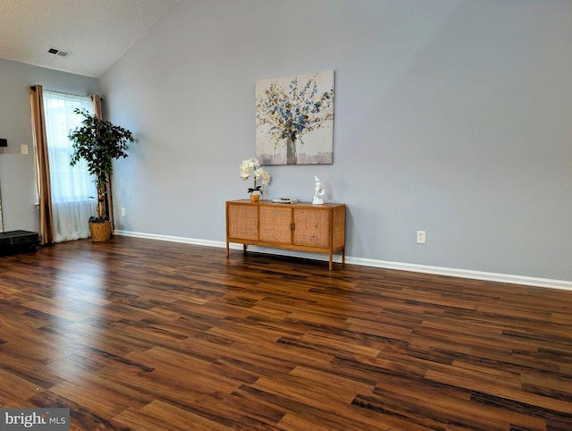 407 Talon Ct, Lawrence, NJ 08648 - empty room with lofted ceiling, wood finished floors, and baseboards